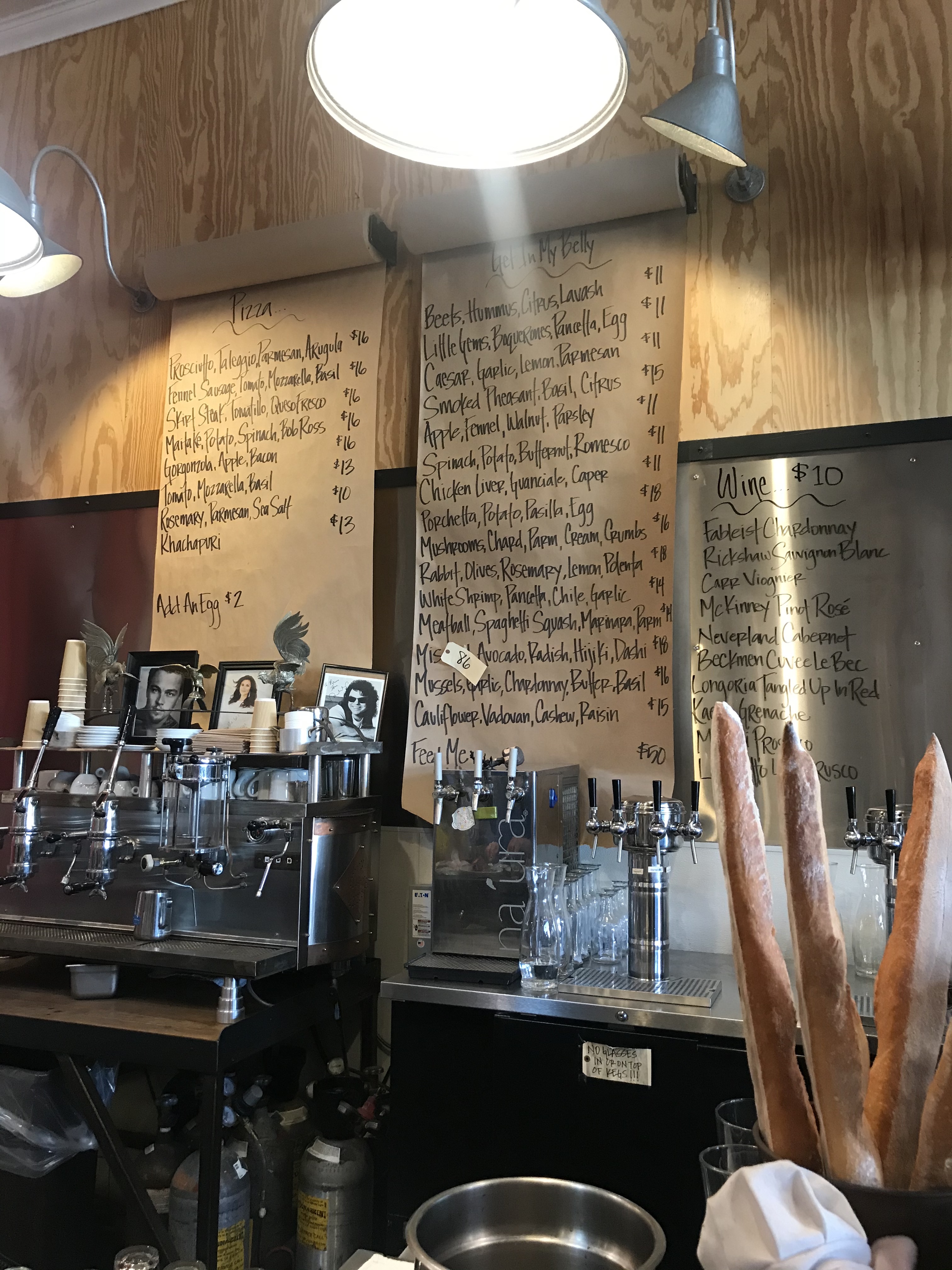 Interior picture of menu hanging on the wall at Industrial Eats.