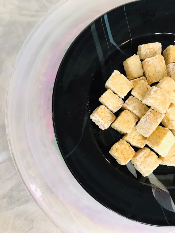 A plate of air fried tofu - before adding the mushroom marinade in Mushroom Marinated Tofu